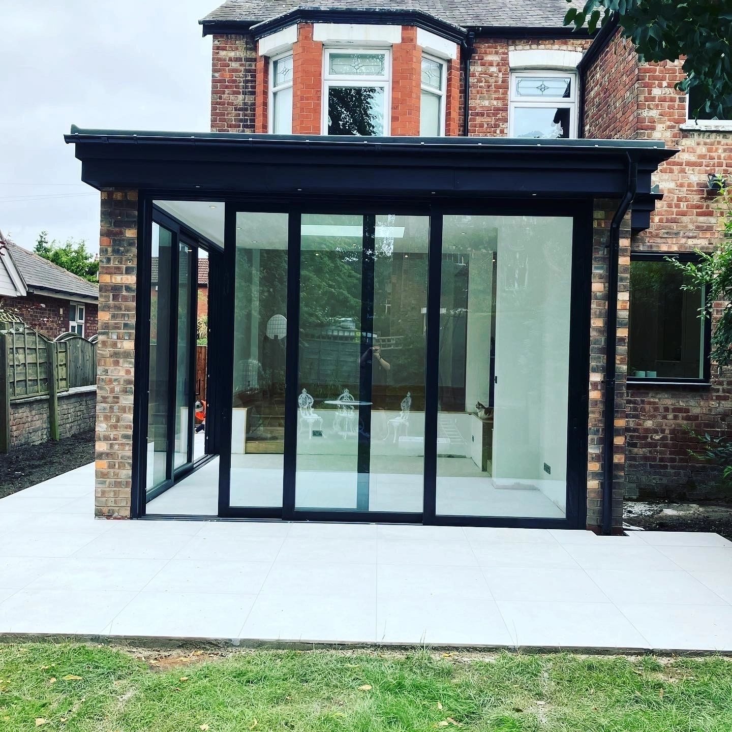 Modern rear house extension with large glass doors and bi-fold windows